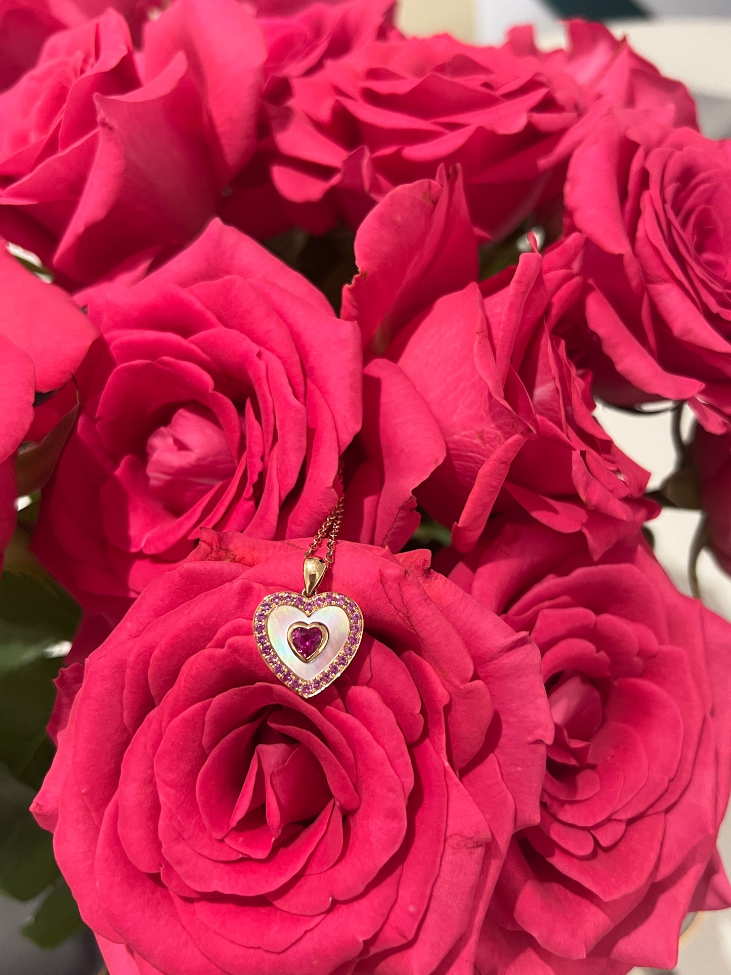 Ruby heart necklace in 18k rose gold with mother of pearl and pink sapphire