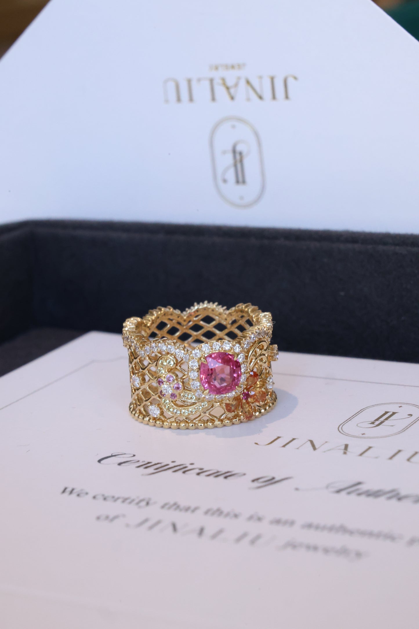 Delicate floral lace ring in 18k yellow gold with hot pink spinel and color sapphires