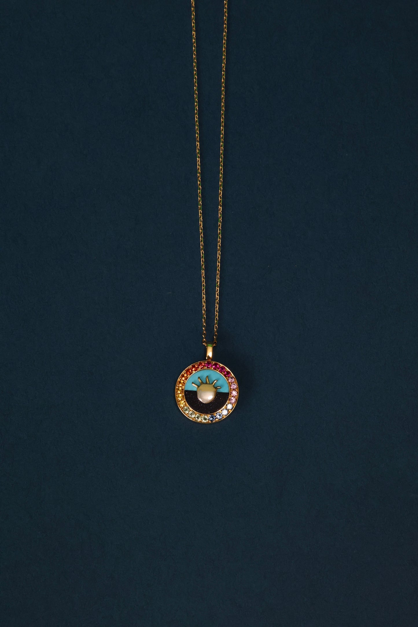 Turquoise pendant in 18k yellow gold with color sapphires