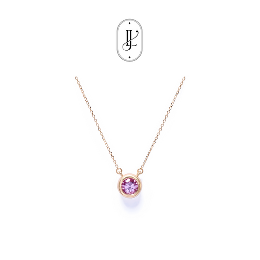 Bezel-set padparadscha necklace in 18k yellow gold