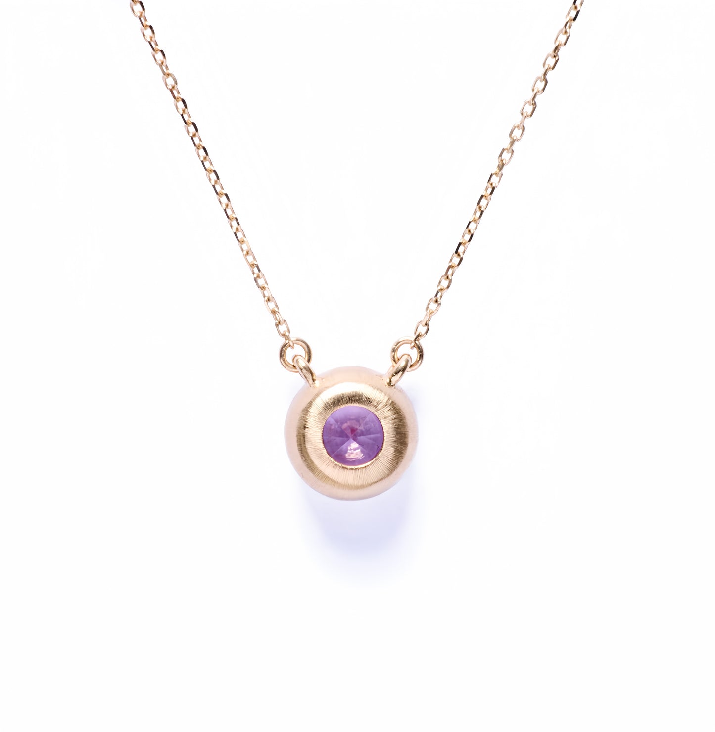 Bezel-set padparadscha necklace in 18k yellow gold